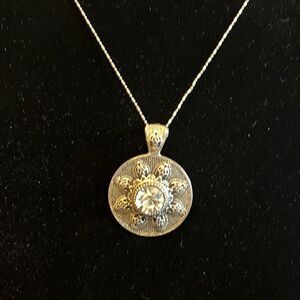 Handcrafted antique looking pendant on a 18 inch silver tone chain